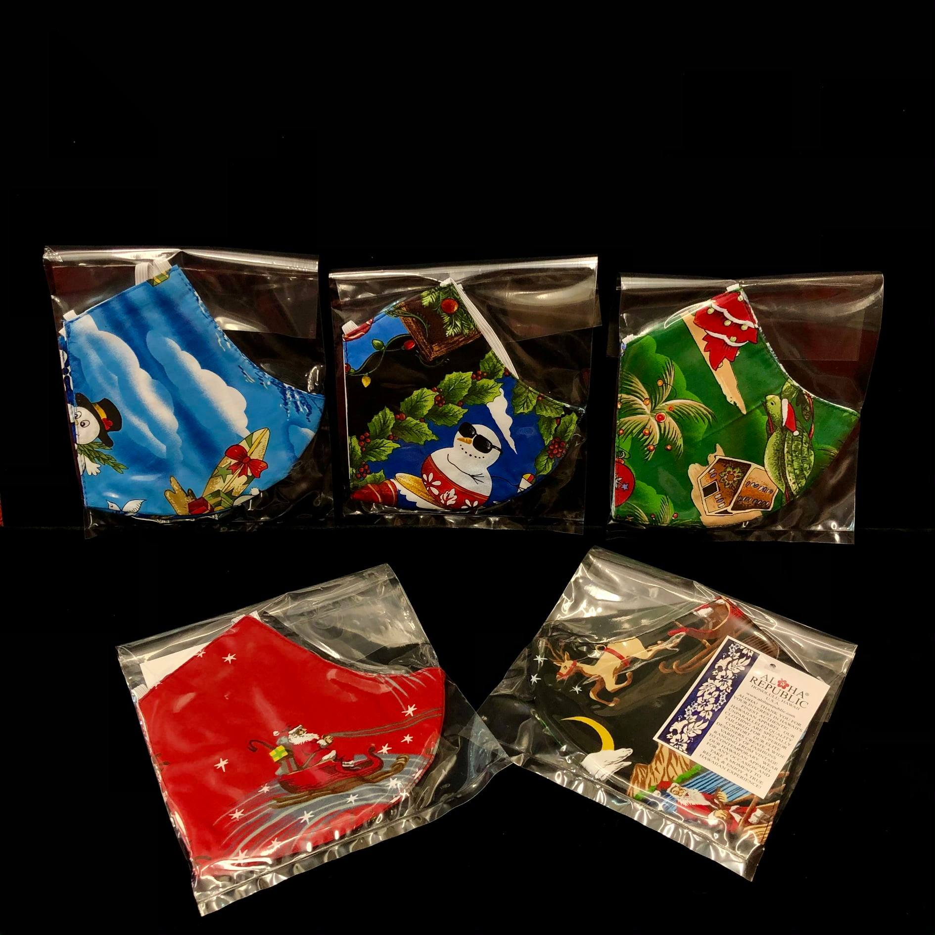 Aloha Republic holiday cotton masks with surfing snowmen, Santa sleigh and tropical Christmas prints