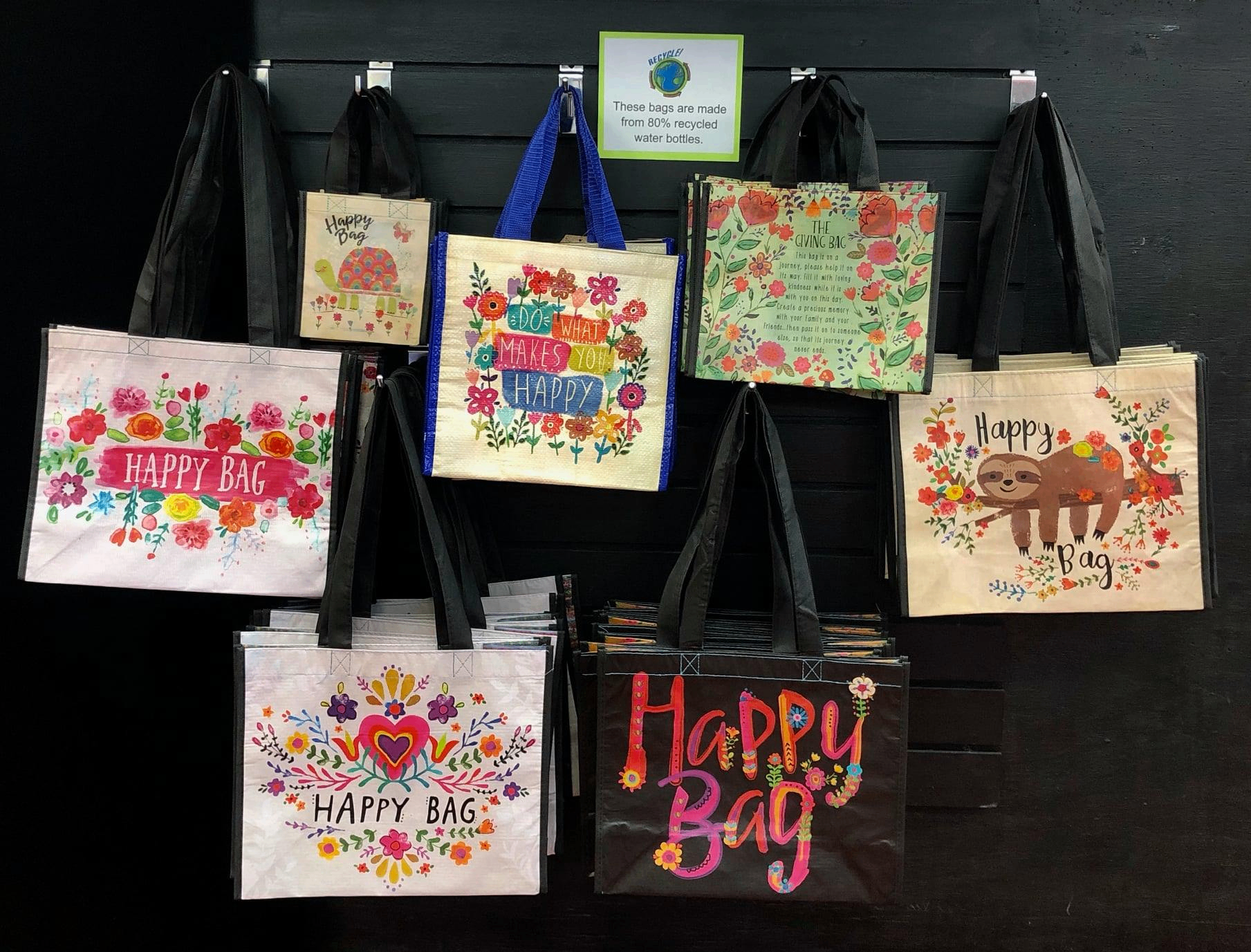 Natural Life Happy Bag reusable totes with floral and sloth designs