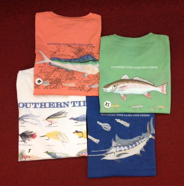 Southern Tide Game Fish Series tees featuring marlin, redfish, lure and billfish artwork on coral, mint, navy and white shirts